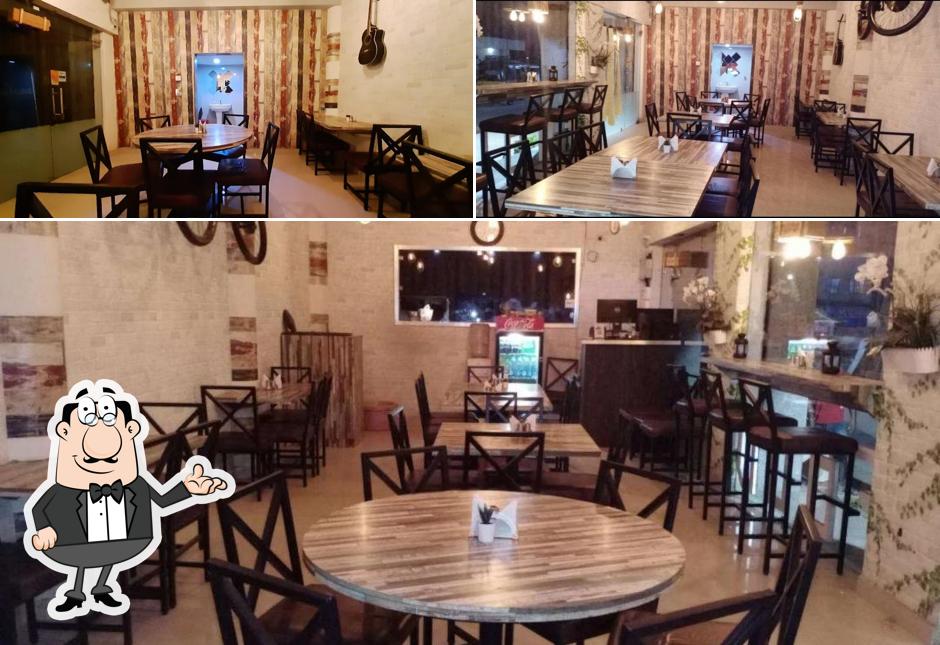 Take a seat at one of the tables at Grill Restro