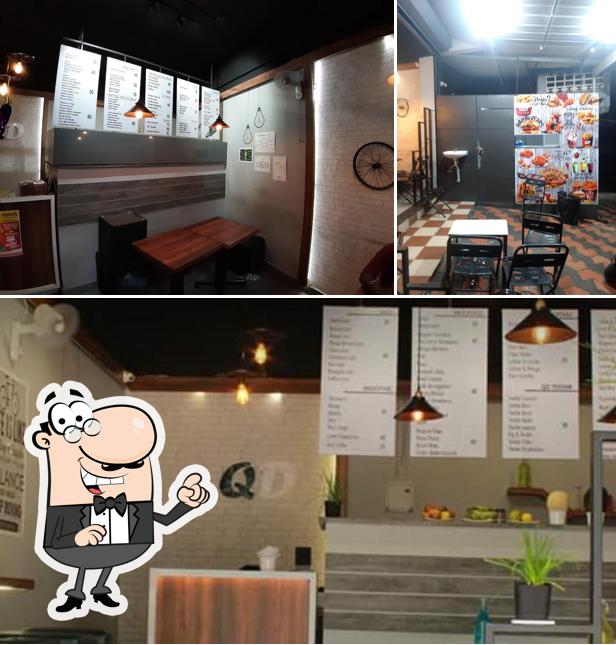 Take a seat at one of the tables at Cafe QD