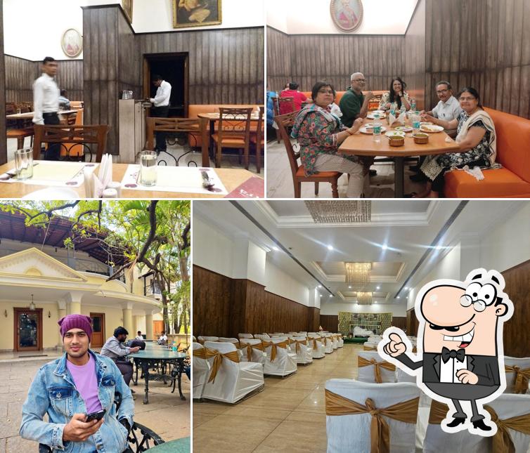 Take a seat at one of the tables at Kshetra Vegetarian Restaurant