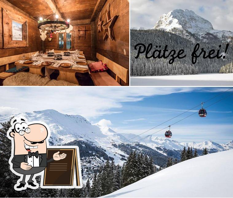 Questa è la foto che presenta la esterno e tavolo da pranzo di Fondue Alp