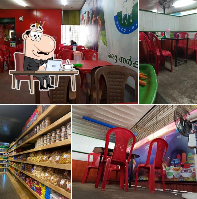 Take a seat at one of the tables at Adithya Bakery and Fast Food