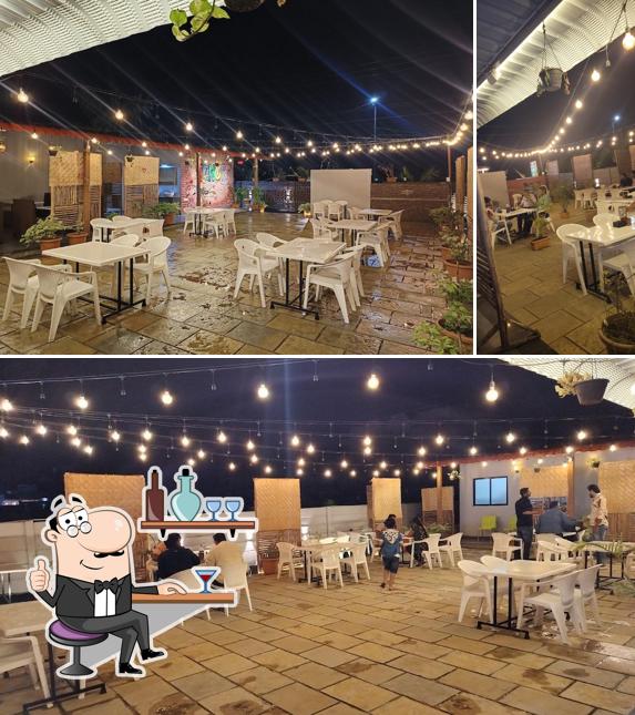 Take a seat at one of the tables at Venus Family Restaurant Open Sky