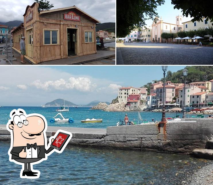 Puoi goderti l'aria fresca da seduto all'esterno di Bar La Perla