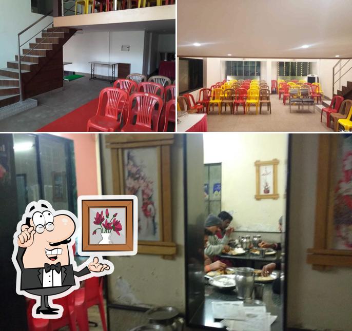 Take a seat at one of the tables at Hotel Atithi