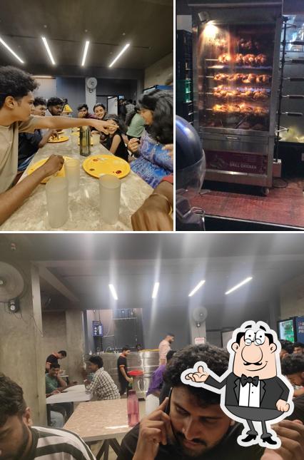 Take a seat at one of the tables at Calicut Cafeteria