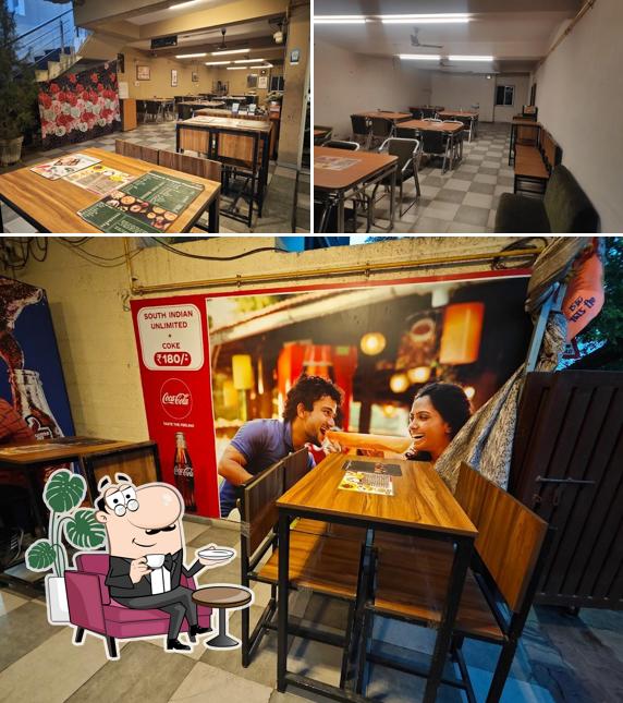 Take a seat at one of the tables at MORIS FAST FOOD