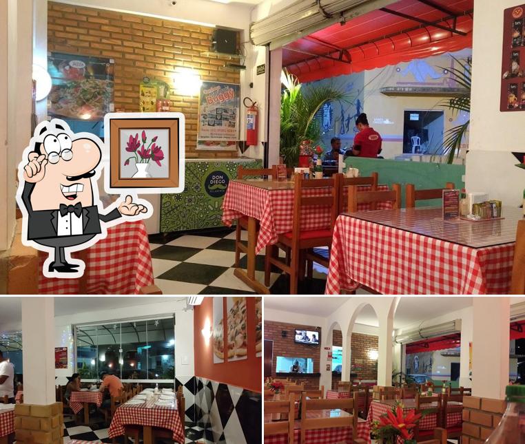 Sente em uma das mesas no Rei da Pizza Maragogi