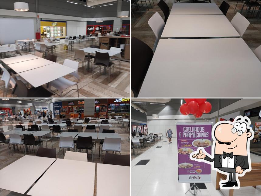 Sente em uma das mesas no Griletto - Extra Santa Rosália