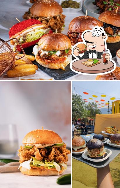 Order a burger at Sliders & Fries