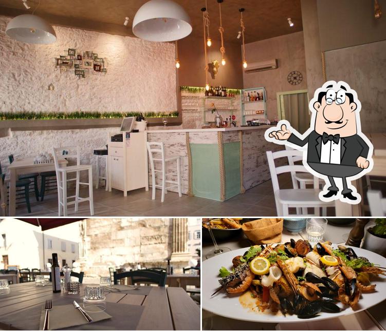 La immagine della interni e cibo di Restaurant "Piazza Nove"