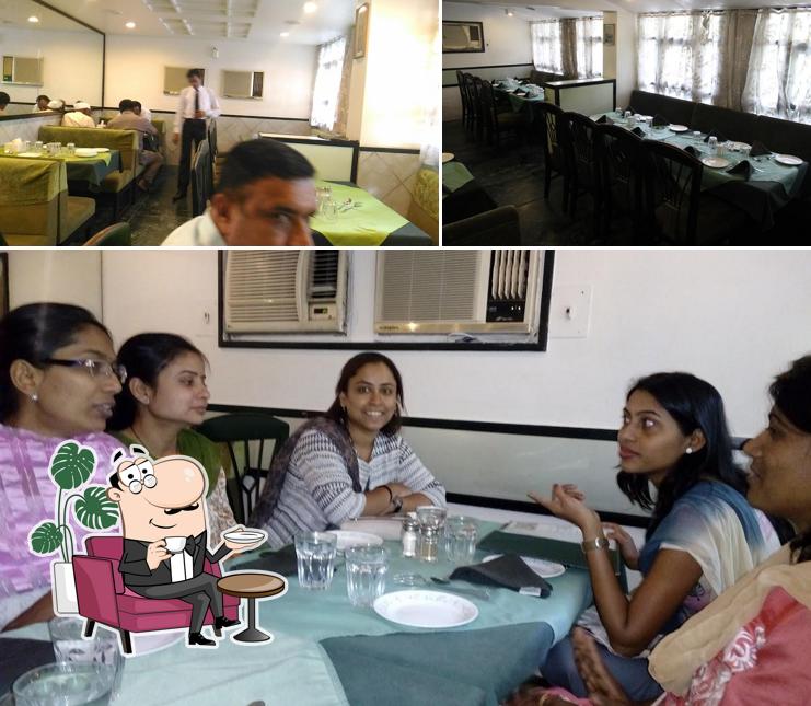 Take a seat at one of the tables at FabHotel Shravan