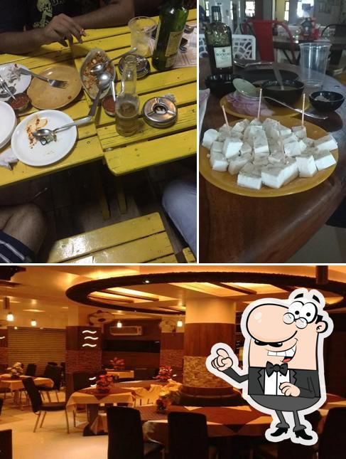 Take a seat at one of the tables at Jalsa Restaurant