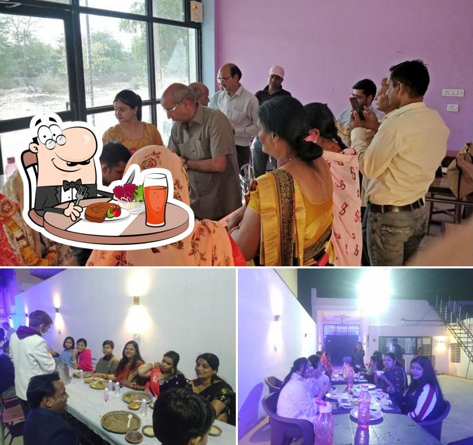The image of dining table and exterior at Mudrika Black Pepper Restaurant