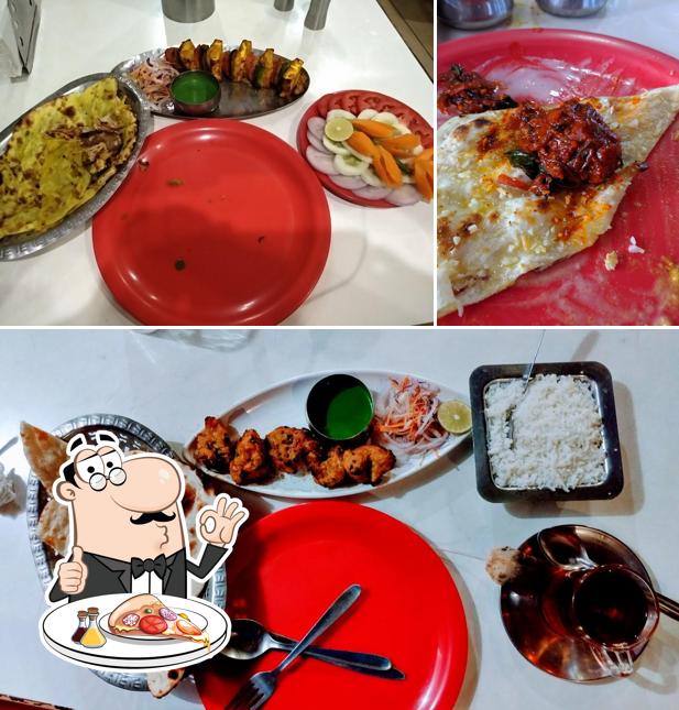 Get pizza at Sathars Restaurant