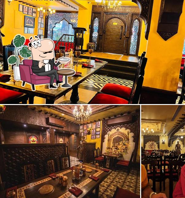 Take a seat at one of the tables at Oudh 1590 Noida 18