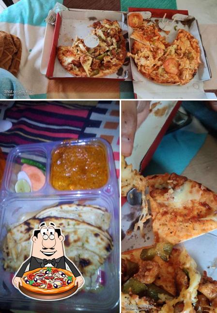 Get pizza at Aryan Family's Delight