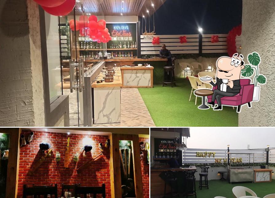 Take a seat at one of the tables at Kapil Dev's Elevens