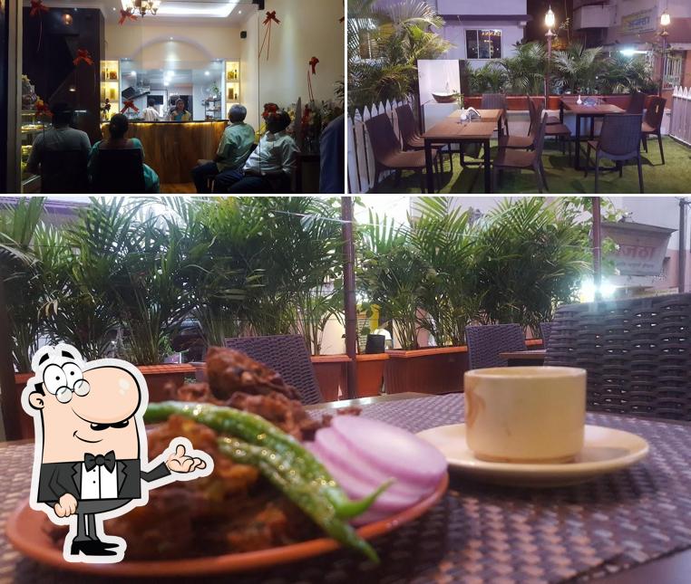 Take a seat at one of the tables at Kitchen Prasanna