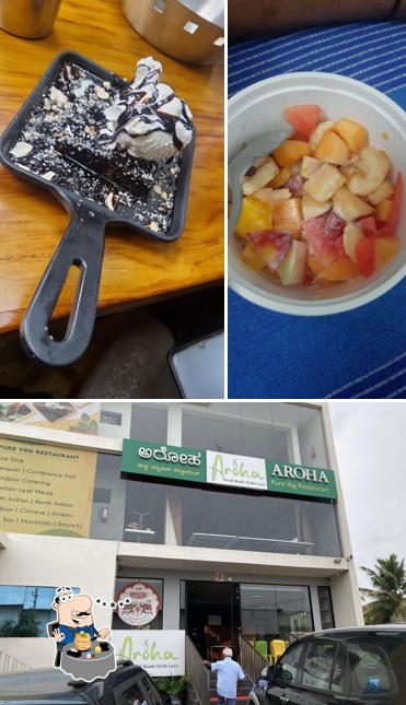 Take a look at the photo displaying food and exterior at Aroha Veg Restaurant