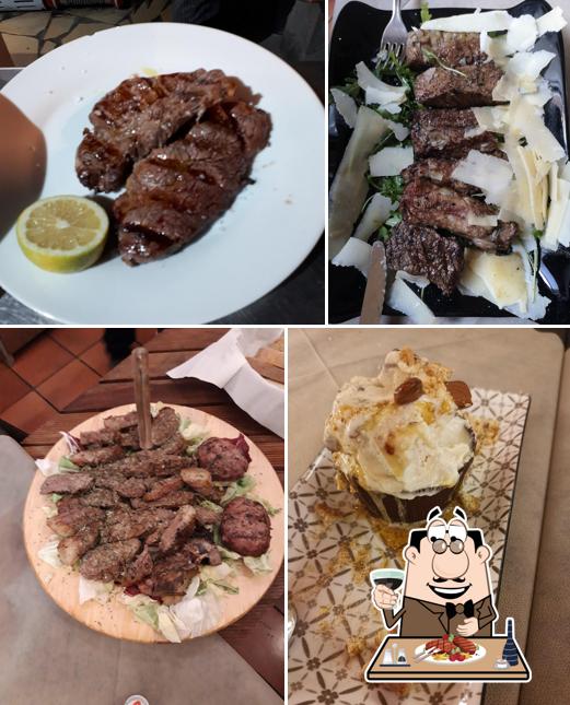 Piatti di carne vengono serviti a L'Oste Maurizio