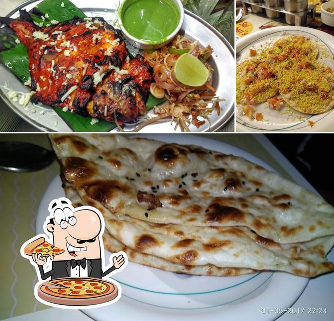 Try out pizza at Tara Palace