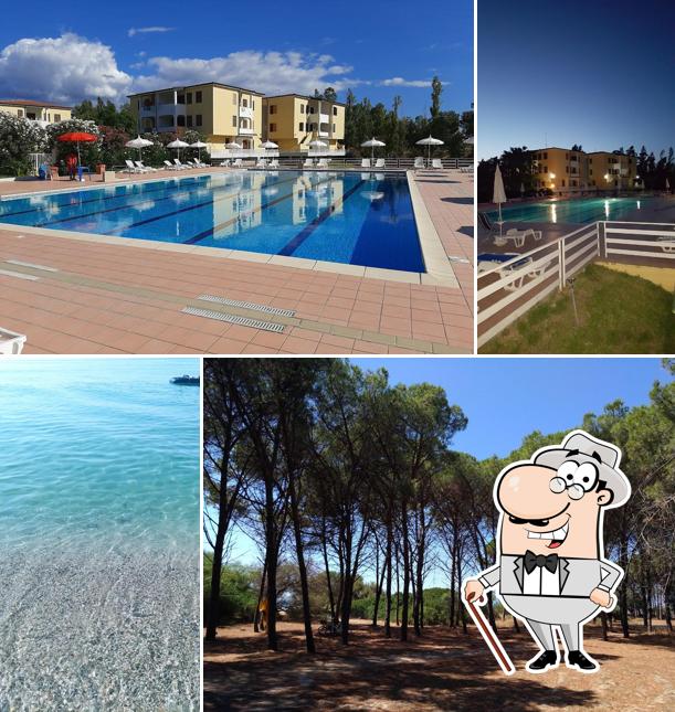 Puoi goderti l'aria fresca da seduto all'esterno di Villaggio Riviera del Sole