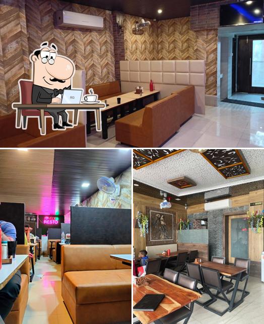 Take a seat at one of the tables at Lovely Restaurant And Cafe Pure Veg Restaurant