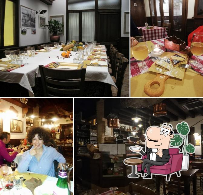 Dai un'occhiata agli interni di Al Ragno hosteria di un tempo