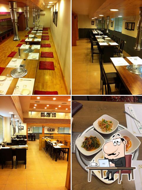 Take a seat at one of the tables at Maljukgeori Korean Restaurant