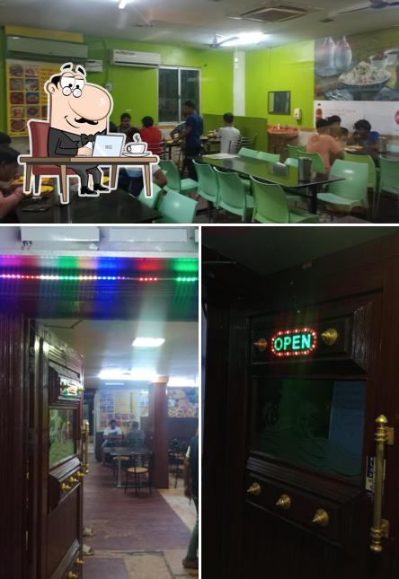 Take a seat at one of the tables at Classic Chettinadu Restaurant (A/c)
