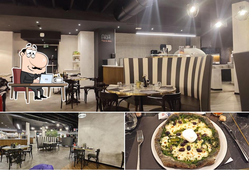 Questa è la foto che raffigura la interni e cibo di Aria pizza & cucina
