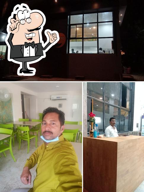 Take a seat at one of the tables at HOTEL SWALPVIRAM