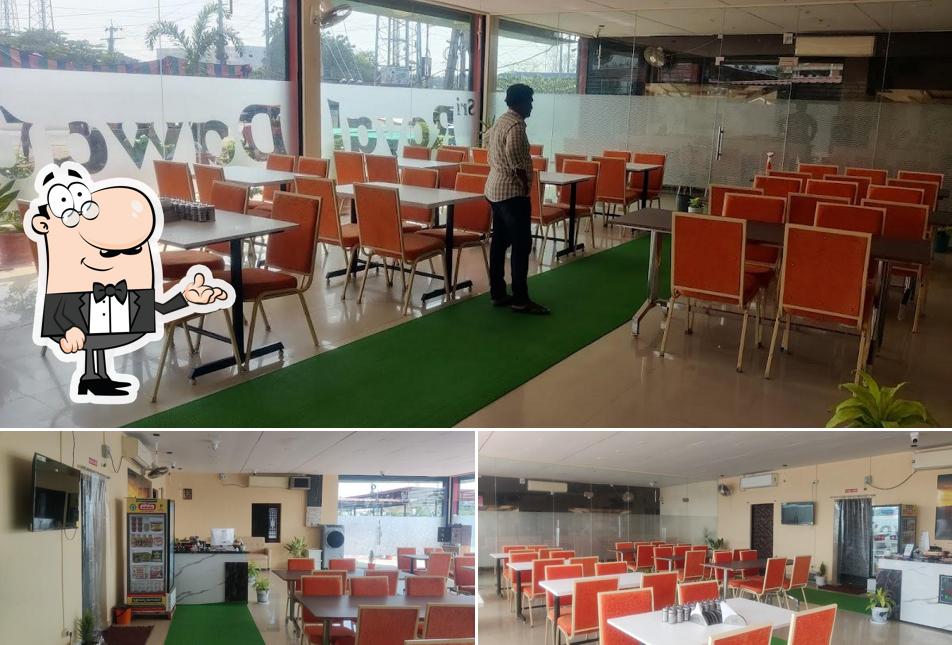 Take a seat at one of the tables at Sri Royal Dawat Restaurant