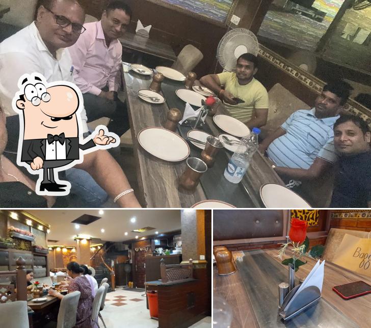 Take a seat at one of the tables at CHULA CHOWKA Restaurant