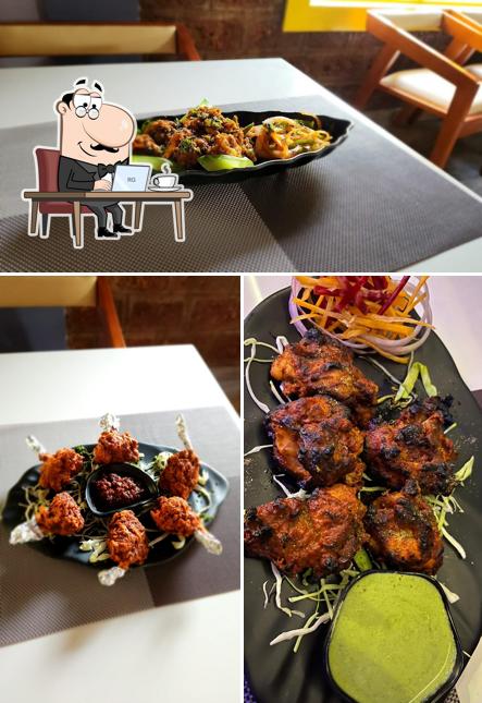 Among various things one can find interior and seo_images_cat_43 at Aranya Amit's kitchen Best restaurant in Ponda