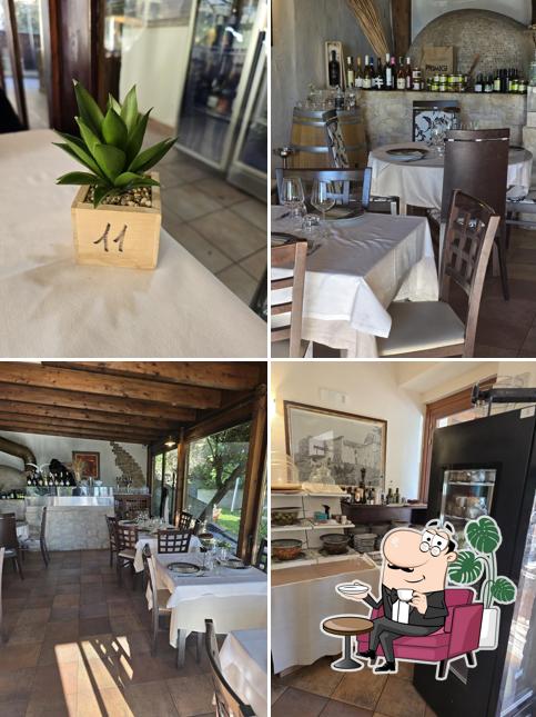 Siediti a un tavolo di Ristorante Ostaria Del Villaggio