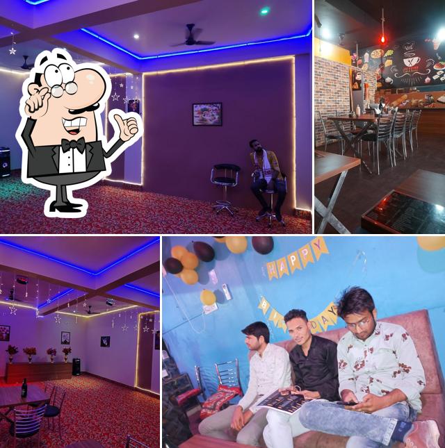 Take a seat at one of the tables at Jai Veeru cafe & Restro