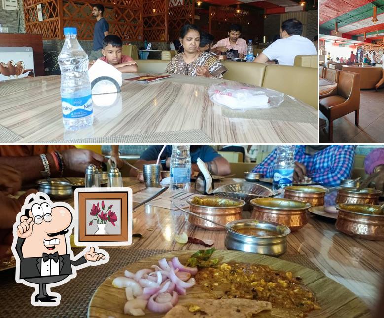 Take a seat at one of the tables at PALEGAR'S CUISINE RESTAURANT