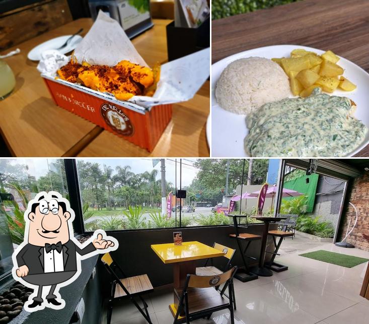 Sente em uma das mesas no The Mellos Burger