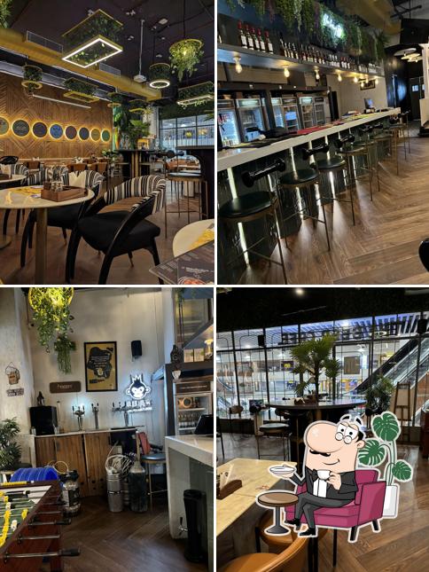 Take a seat at one of the tables at The beer cafe gaur city