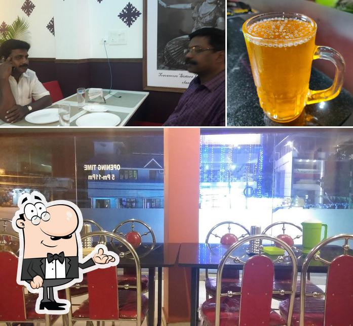 This is the image displaying interior and beverage at Balan's Kamalam Restaurant