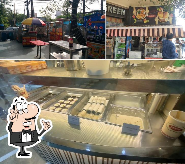 Take a seat at one of the tables at JSB Evergreen Snacks & Sweets Sector 29 -Noida