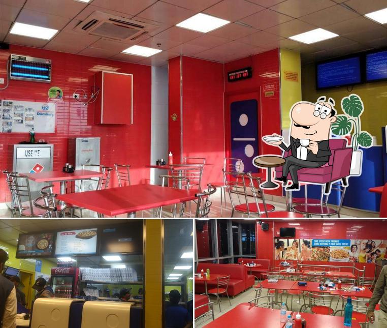 Take a seat at one of the tables at Domino's Pizza Manasarovar, Jaipur