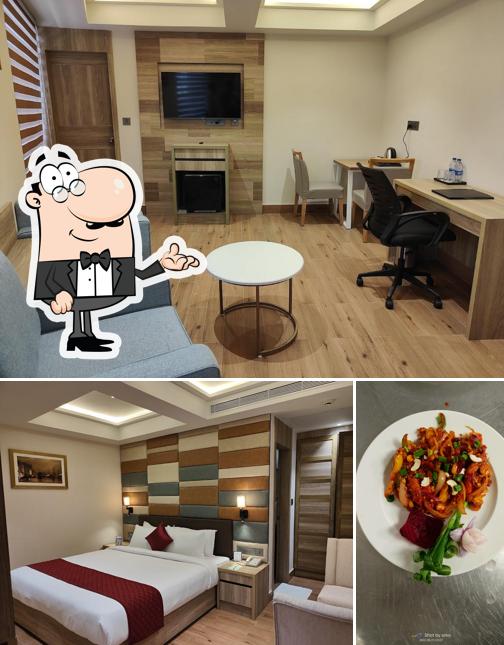 This is the image depicting interior and food at Capital Park Residency, Kazhakkoottam