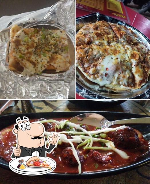 Get pizza at Kha Lo Restaurant