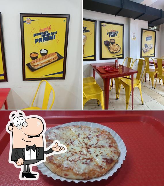 Check out the picture depicting interior and food at The Panini House - Adajan