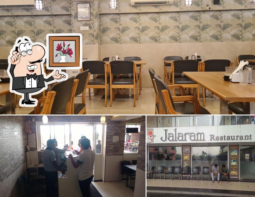 Take a seat at one of the tables at Jalaram Khichdi Restaurant