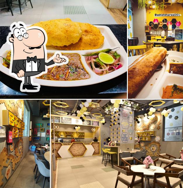 Take a seat at one of the tables at BitesBee - A Food Nest