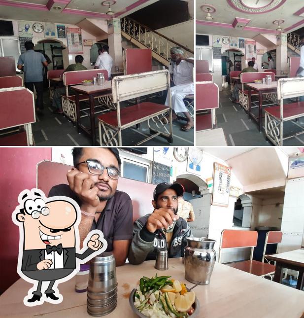 Take a look at the picture depicting interior and food at Satyavijay Restaurant