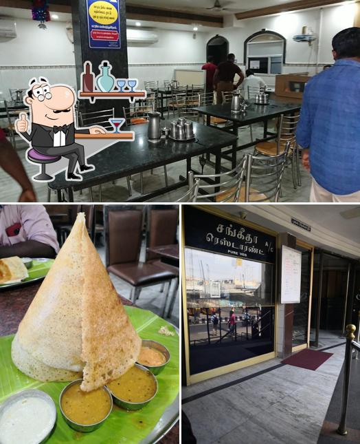 Take a seat at one of the tables at Sivasakthi restaurant